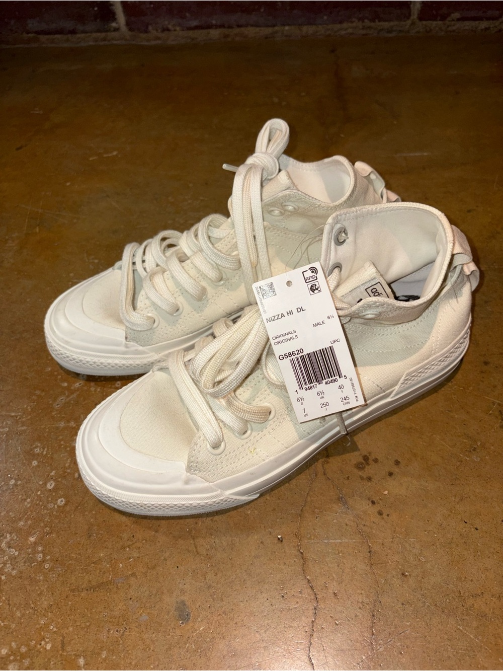 Converse Nizza Mid-Top Sneakers in Off-White Canvas